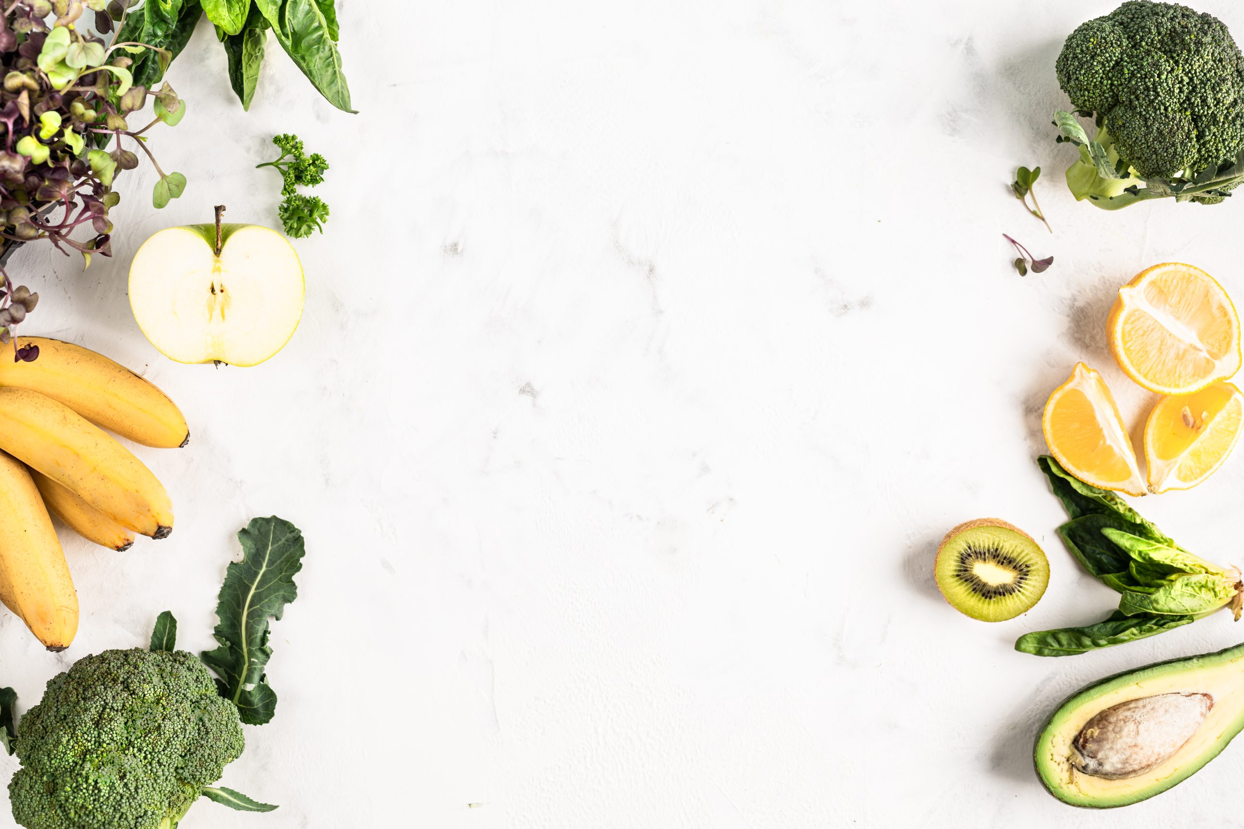 frame-ingredients-green-smoothie-vegetables-fruits-fresh-salad-white-background-top-view-scaled